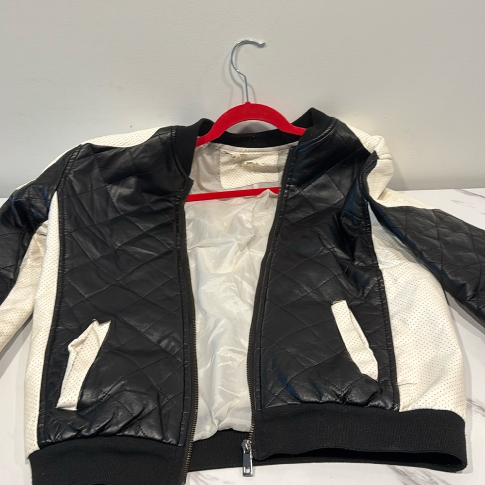 Black and white faux leather jacket 
Size small